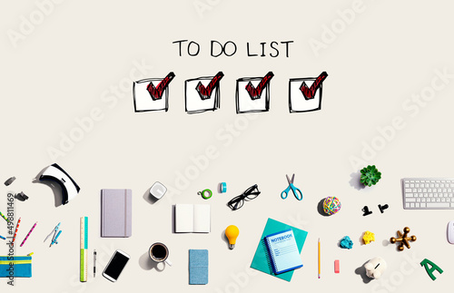 To do list with collection of electronic gadgets and office supplies