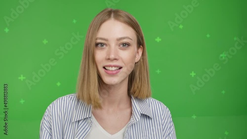 Happy pretty caucasian girl smiling face and talking to webcam make video call at home talking chatting by virtual video call zoom app online videocall meeting on green screen background. Chroma key