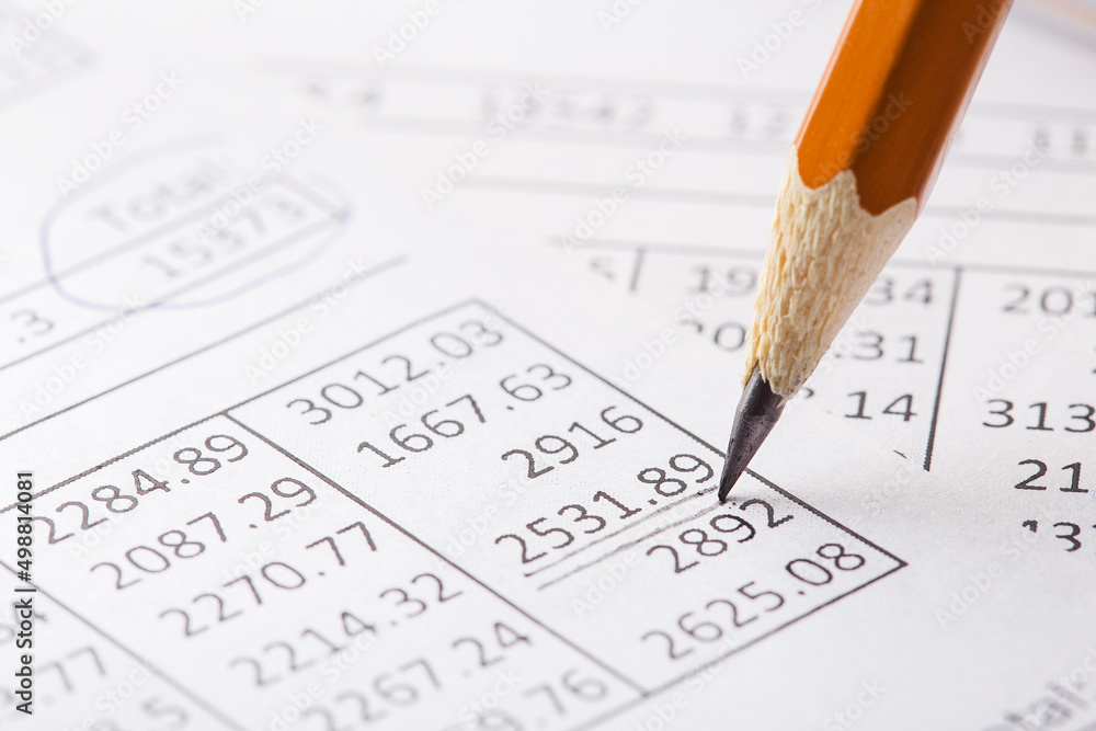 Accounting document with pencil and checking financial chart. Concept of banking, financial report and financial audit. Accounting document with pencil and checking financial chart. Concept of banking, financial report and financial audit.