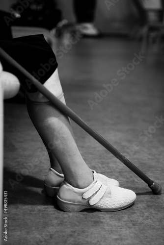 Elderly person in a retirement home with his cane.