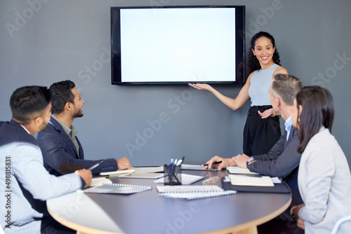 Presenting her foolproof plan to all. Shot of a young businesswoman giving a presentation to her colleagues in an office.