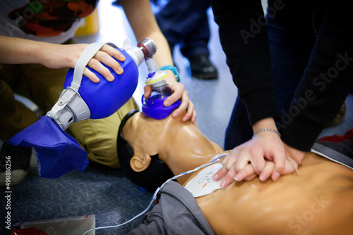 First aid training: alternate use of a manual resuscitator bag. photo