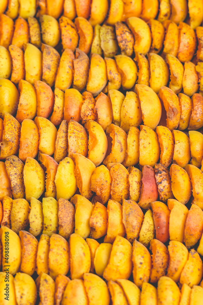 Fototapeta premium The process of home cooking dried fruits in an electric dryer.