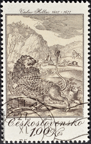 Cancelled postage stamp printed by Czechoslovakia, that shows Hunting theme - The Lion and the Mouse, by Vaclav Hollar (1665), circa 1975. photo