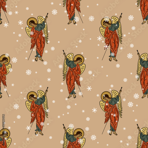 Seamless winter pattern with beautiful winged guardian angels and snowflakes. On pink background. Seasonal Christmas design.