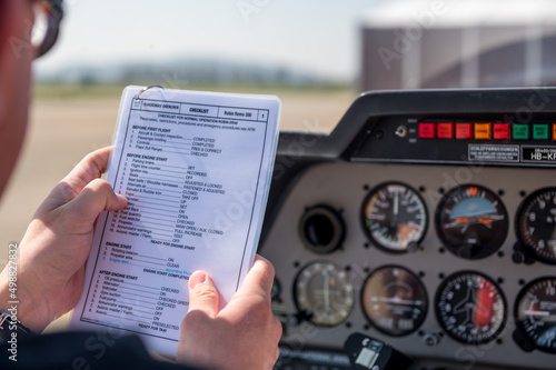 flight preparations in the cockpit with a checklist