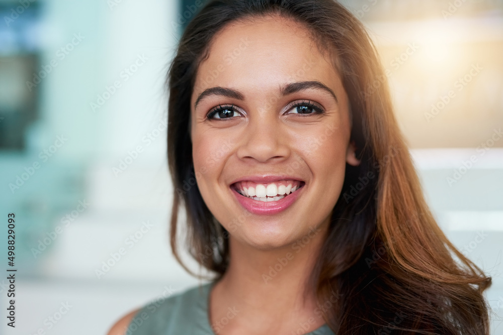 I get a lot out of my job. Portrait of a young businesswoman posing in an office. I get a lot out of my job. Portrait of a young businesswoman posing in an office.