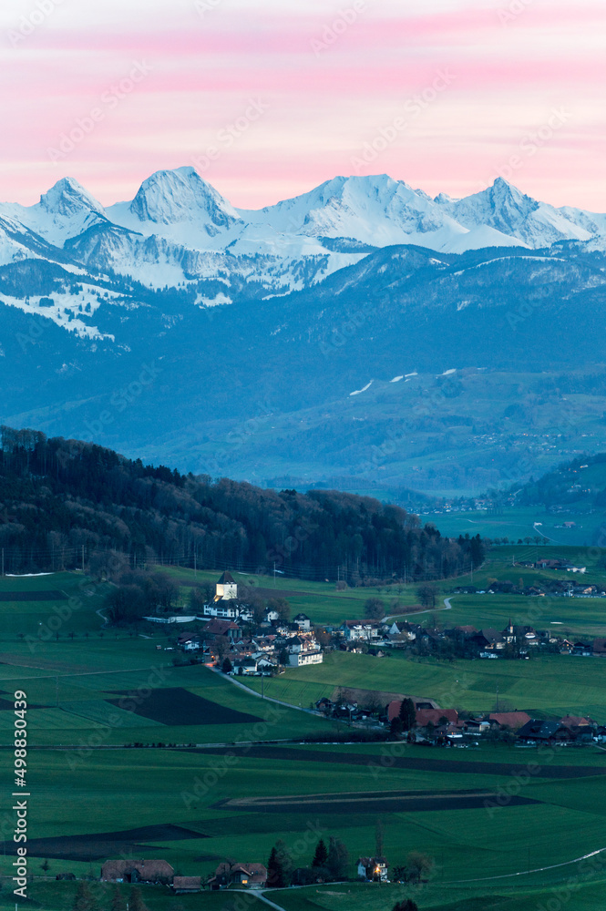Fototapeta premium Schlosswil and Gantrisch Ridge on a spring sunset
