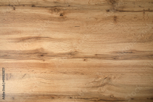 Wooden background texture. Light brown surface of old knotty wood with a natural color