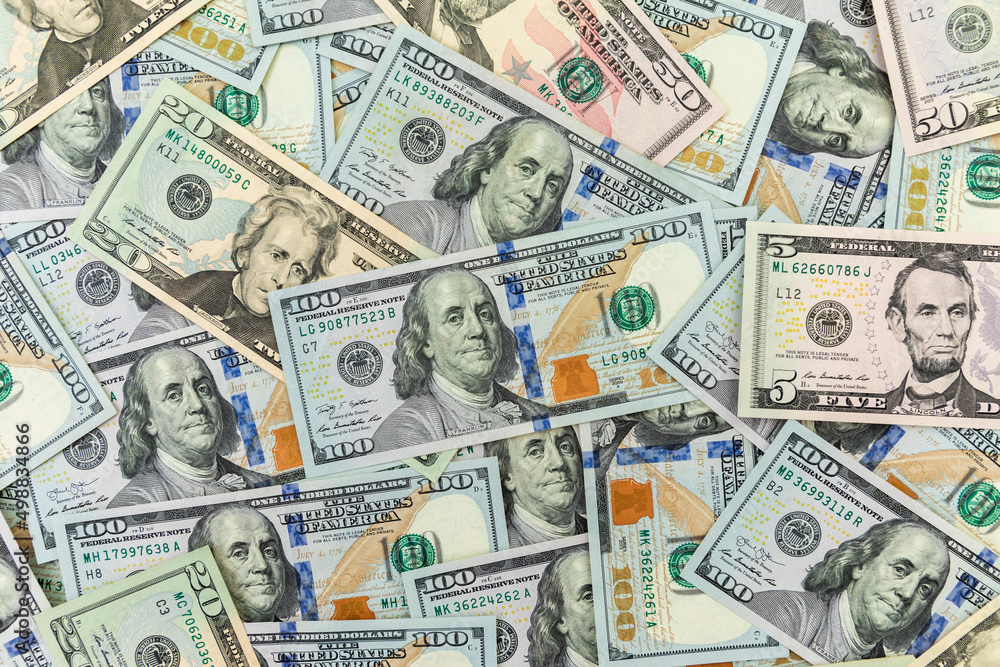 Texture US dollars. Financial background of 5, 10, 20, 50 and 100 dollar banknotes. Texture US dollars. Financial background of 5, 10, 20, 50 and 100 dollar banknotes.