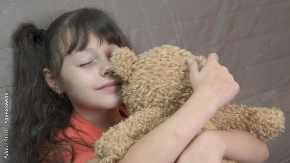 Loving the plush toy. A little girl love her plush toy in her hands. Loving the plush toy. A little girl love her plush toy in her hands.