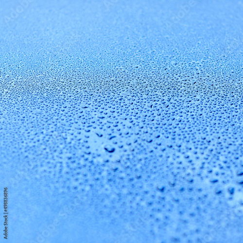 Aqua abstractions. Shot of drops of water on a smooth surface.