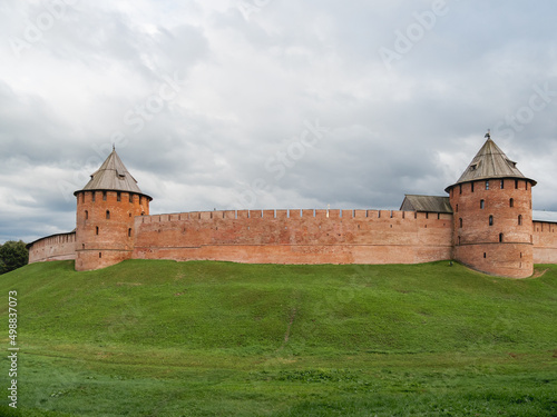 Walls and Fyodorovskaya and Mitropolichya towers of Novgorod Kremlin. Summer cloudy day in Veliky Novgorod, Russia.