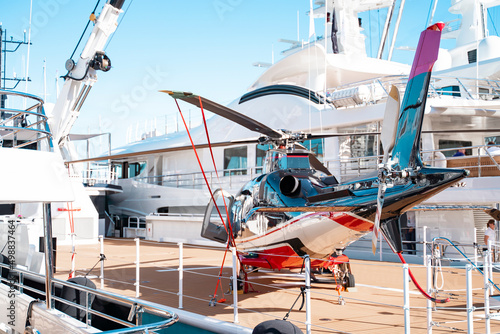 Helicopter landed on superyacht helideck on Monaco yacht show  © DiMar