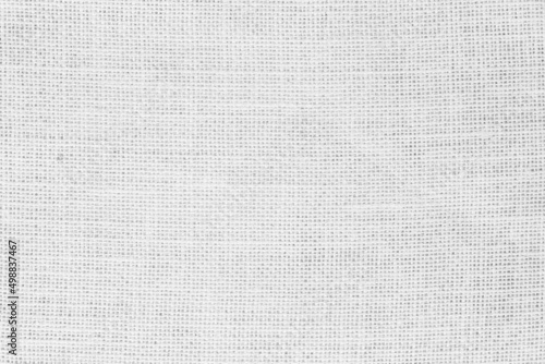 White fabric jute hessian sackcloth canvas woven gauze texture pattern in light white color blank decoration. 