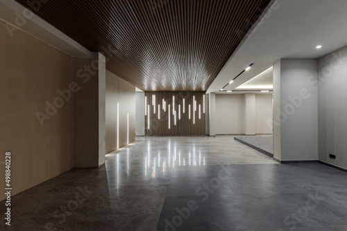 Spacious modern entrance interior in a multi-storey residential building in the city center.