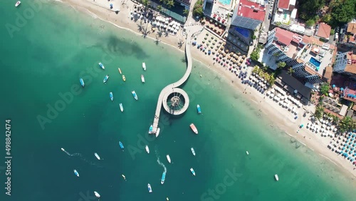 Cenital camera with rotation view of coast and pier [4k] Location: Puerto Vallarta, México. photo
