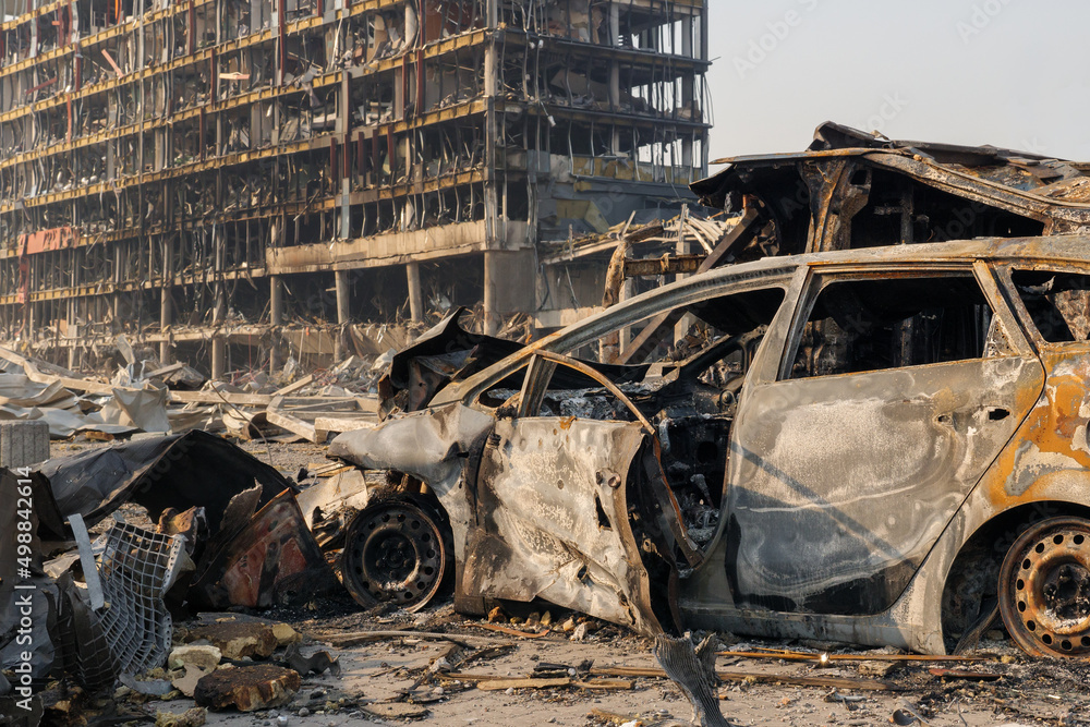 custom made wallpaper toronto digitalAftermath shell of civilian bombed city damage car. 2022 Russian invasion of Ukraine war torn city destroyed car burn out. Bomb attack Russia war damage Ukraine city war destruction Russian aggression