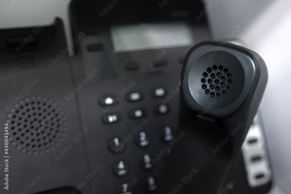 Close-up view of a landline telephone receiver. Close-up view of a landline telephone receiver.