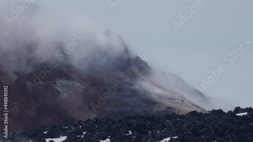 Caldera of Avachinsky stratovolcano, also known as Avacha Volcano. Swinging steam from hot geysers. Kamchatka Peninsula, Russia.