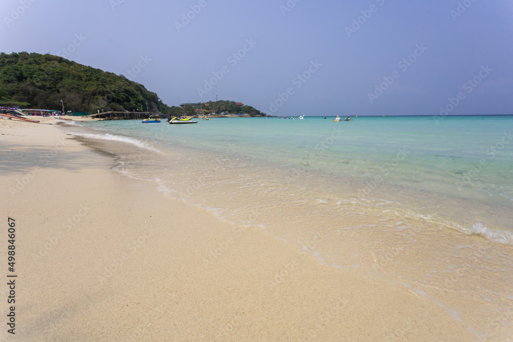 beach with white sand beach wave on the white sand beach and space on blue sky on sunny day