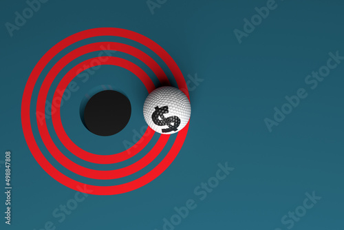 Golf ball dollar symbol and bull's-eye. On dark blue colored background. Horizontal composition with copy space. Isolated with clipping path.