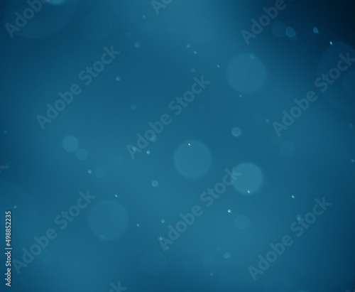 Blurred abstraction of dark blue background gradient. Bubbles or bokeh, both large and small
