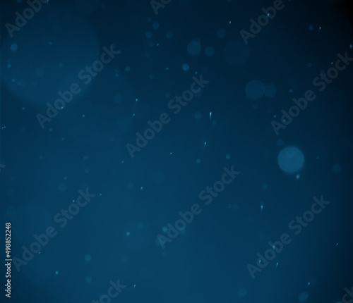 Illustration. Small and large circle bokeh from spray and blur, dark blue background.