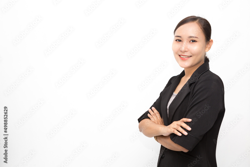 Beautiful Asian business woman wearing black suit with her crossed arms ...