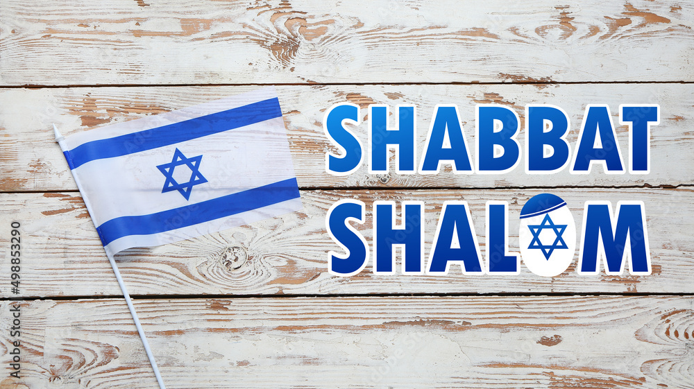 Flag of Israel and text SHABBAT SHALOM on wooden background - obrazy, fototapety, plakaty 