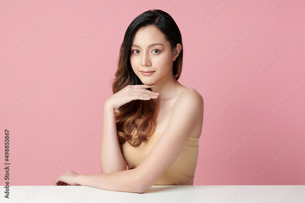 Beautiful young asian woman with clean fresh skin on pink background, Face care, Facial treatment, Cosmetology, beauty and spa, Asian women portrait. Beautiful young asian woman with clean fresh skin on pink background, Face care, Facial treatment, Cosmetology, beauty and spa, Asian women portrait.