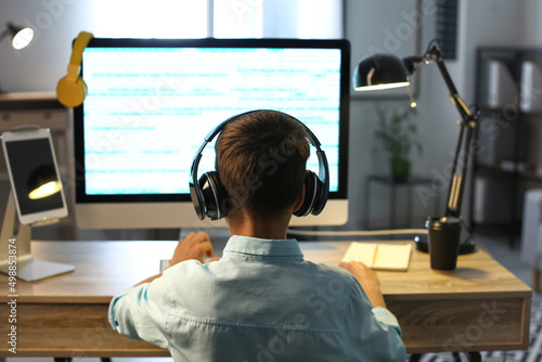 Cute little programmer usin...