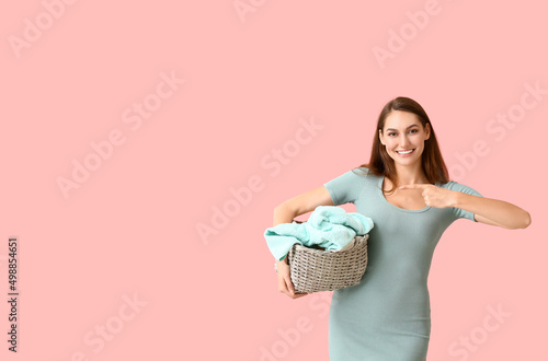 Smiling young woman holding...
