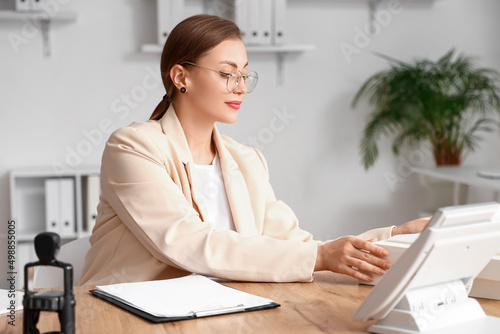 Female notary public workin...