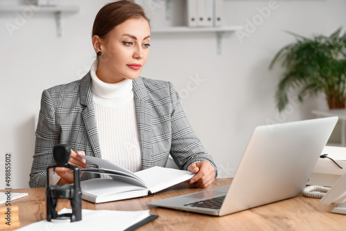 Female notary public workin...