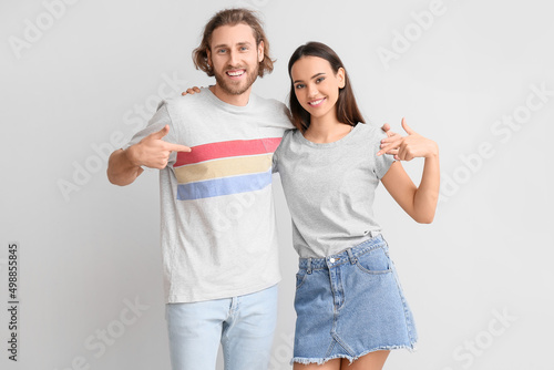 Young couple in stylish t-s...