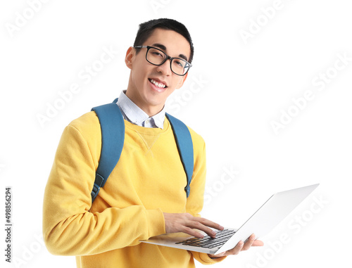 Male Asian student using laptop on white background