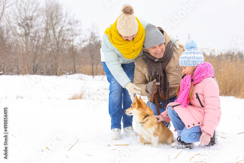 Happy little girl with Corg...