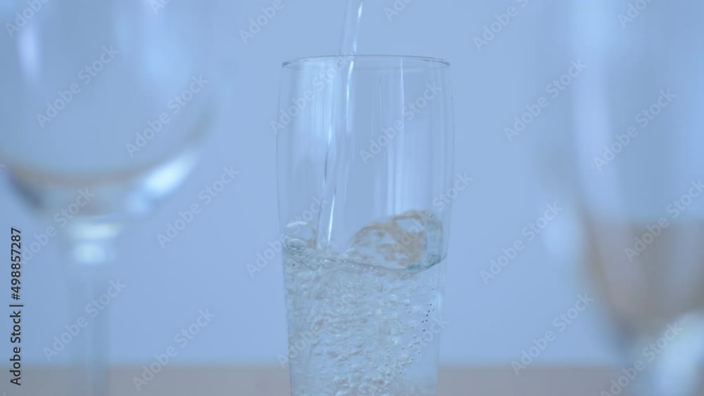 Pour carbonated water into clear glass Pour carbonated water into clear glass