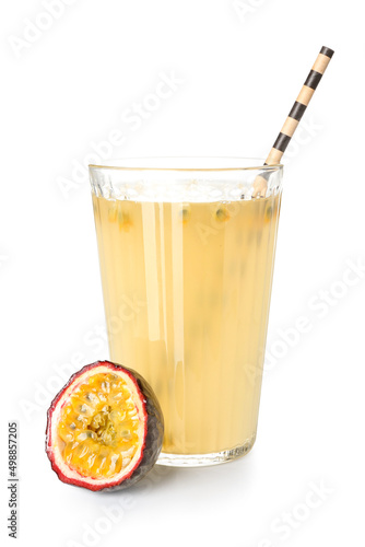 Glass of delicious passion fruit juice on white background
