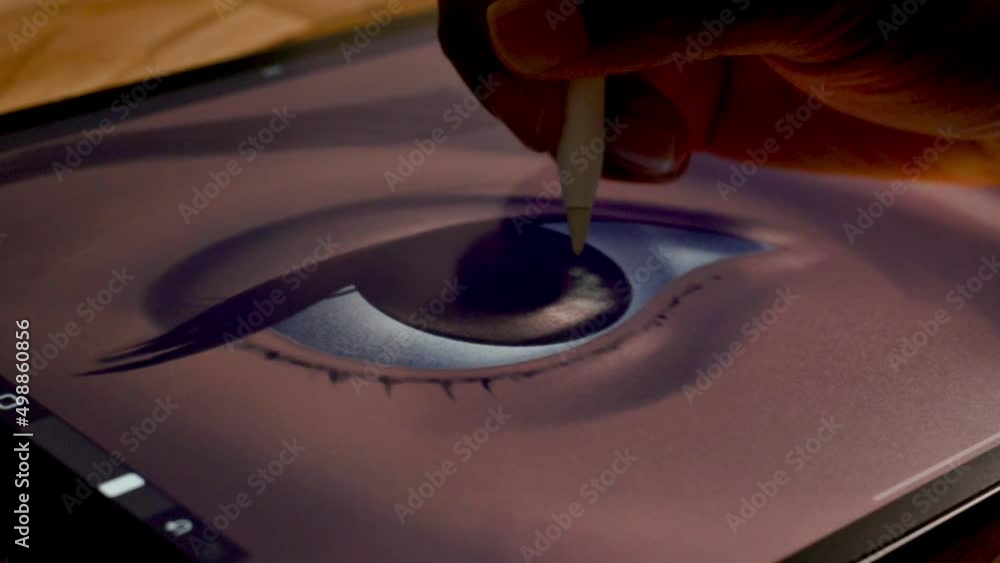 close up of a person painting an eye with a tablet close up of a person painting an eye with a tablet