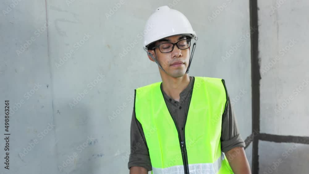 Young asian engineers are working on the construction site. Wear a yellow helmet safety and uniform staff. Real Estate Project with Civil Engineer. Young asian engineers are working on the construction site. Wear a yellow helmet safety and uniform staff. Real Estate Project with Civil Engineer.