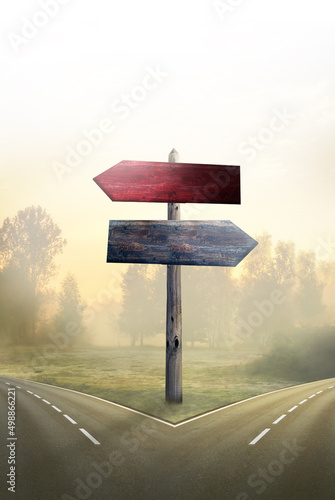 Fotografija wooden signposts for two different roads