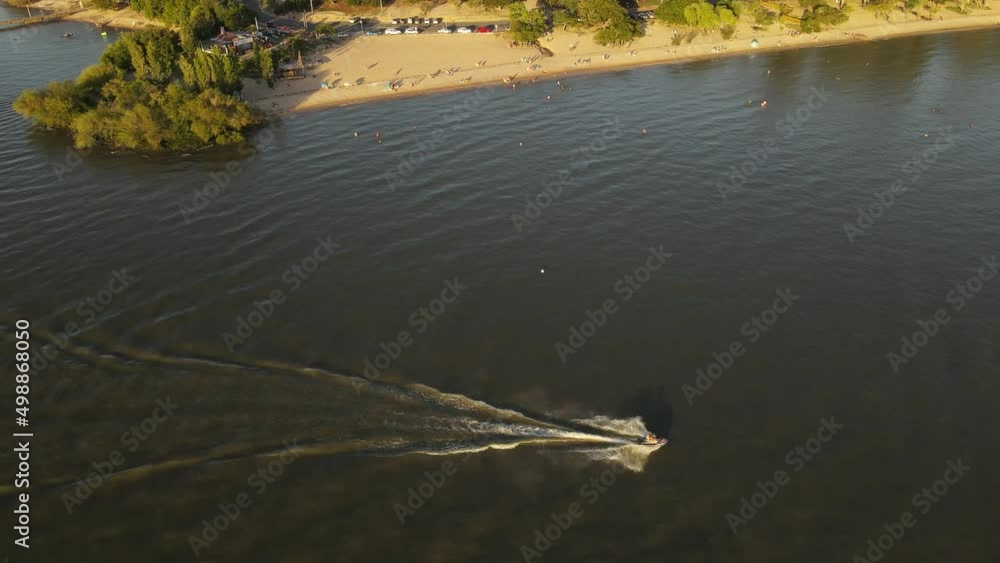 Hobby driven inflatable jet ski thrilling ride at Uruguay river aerial Hobby driven inflatable jet ski thrilling ride at Uruguay river aerial