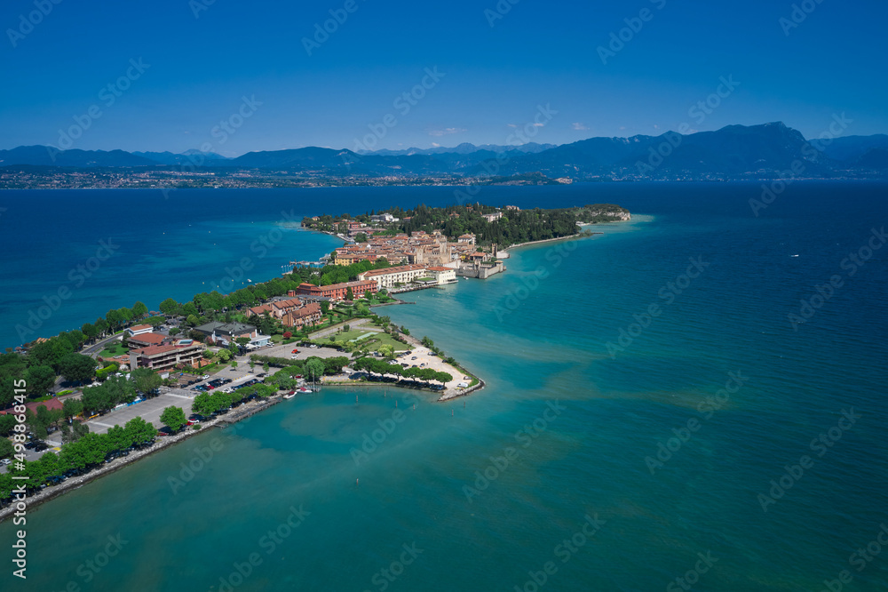 Sirmione, Lake Garda, Italy. Aerial view of the Sirmione peninsula. In the background the mountains of Lake Garda