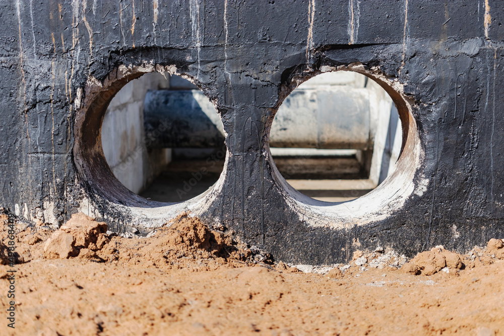Laying of underground pipes in concrete chamber. Installation of water