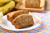 Banana bread on white plate with fork ready to eating