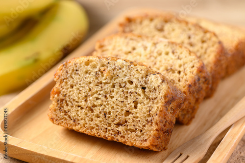 Banana bread on wooden plate with fork ready to eating