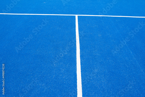partial view of a blue turf paddle tennis court © Vic
