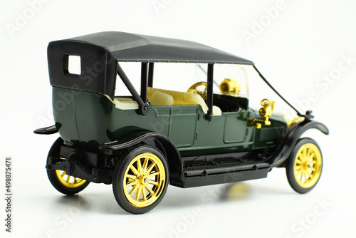 Miniature model of a vintage black car, isolated. © Natalya
